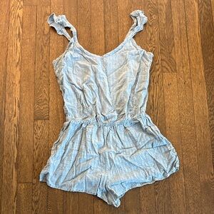 Blue romper with ruffle sleeves